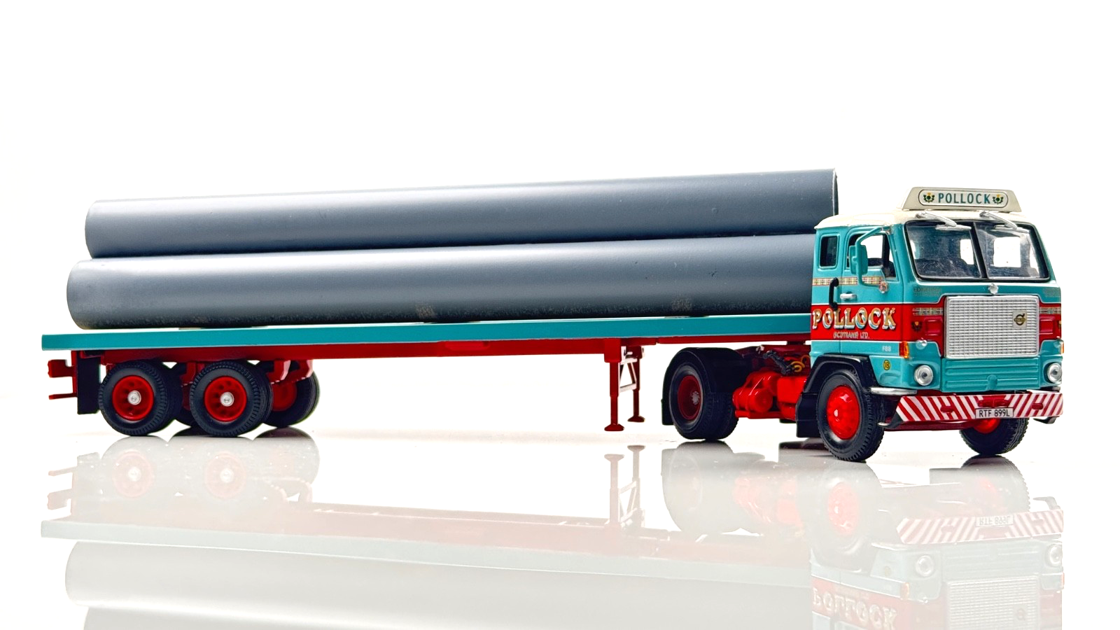 CORGI 1/50 SCALE - POLLOCK (SCOTRANS) LTD VOLVO F88 CAB & TRAILER W/PIPE LOAD UB