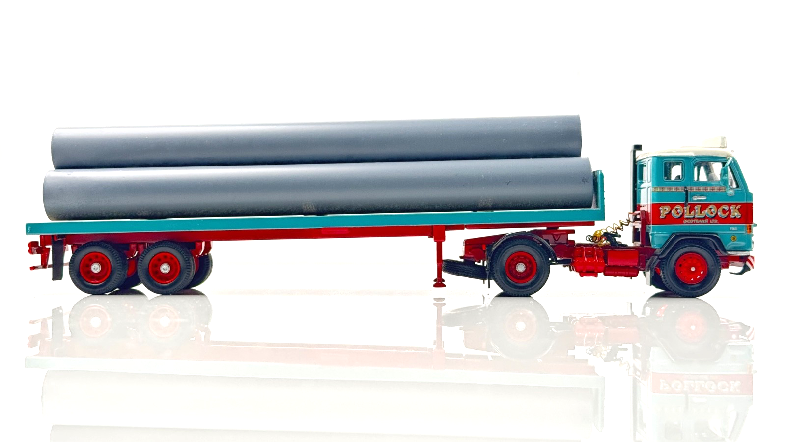 CORGI 1/50 SCALE - POLLOCK (SCOTRANS) LTD VOLVO F88 CAB & TRAILER W/PIPE LOAD UB